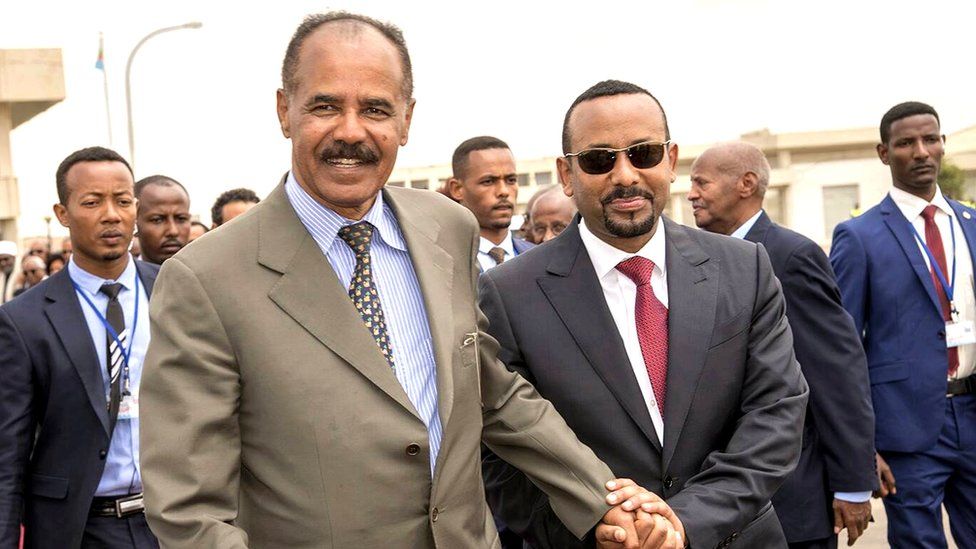 Isaias and Abiy hold hands