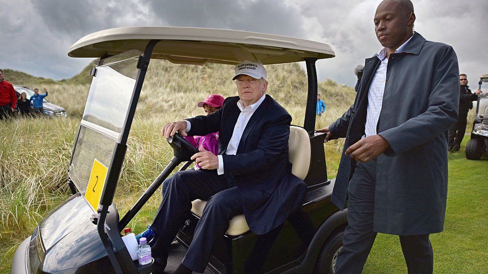 President Trump driving a golf buggy