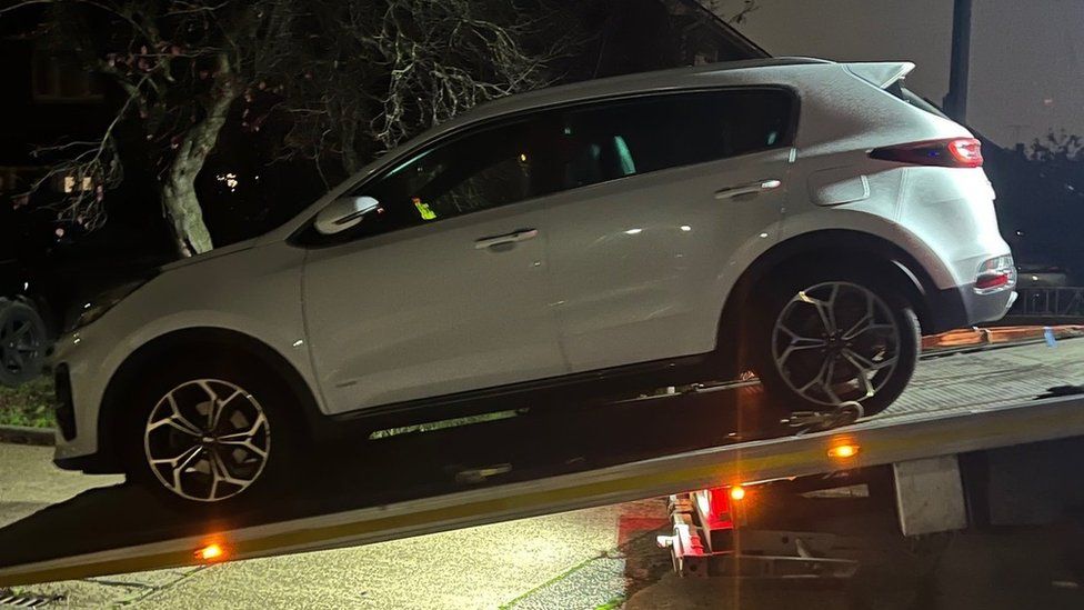 Car being towed away