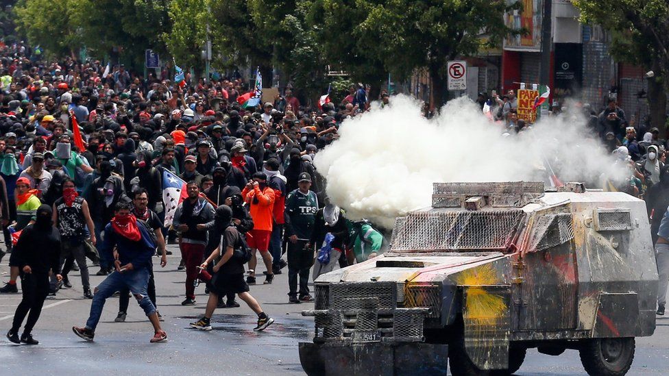 Demonstrators clash with security forces during a protest against Chile's government in Valparaiso on 12 November, 2019.