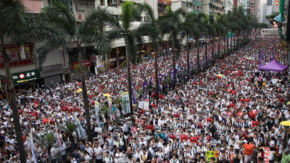 Protesters take part in a march against amendments to an extradition bill in Hong Kong, China, 09 June 2019