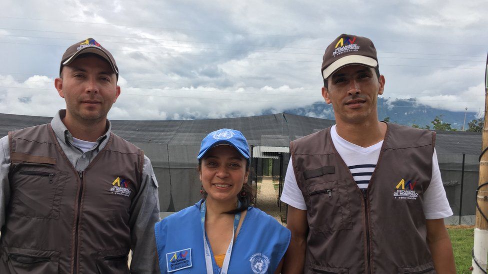 Two government observers and a UN observer pose in the Icononzo transition zone