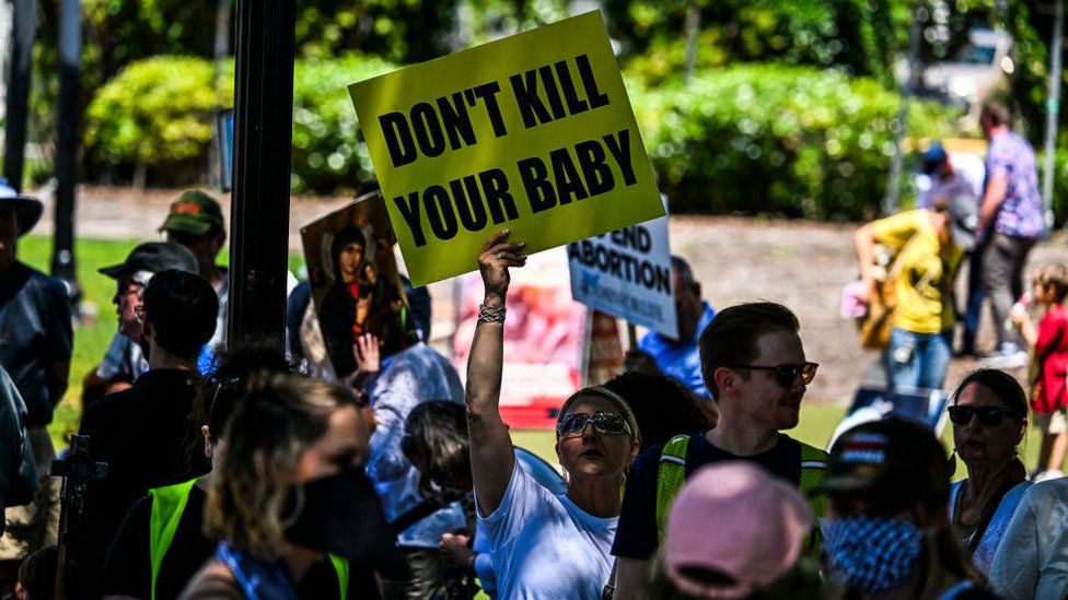 Anti-abortion activists protest near the "Rally for Our Freedom" to protect abortion rights for Floridians, in Orlando, Florida, on April 13, 2024