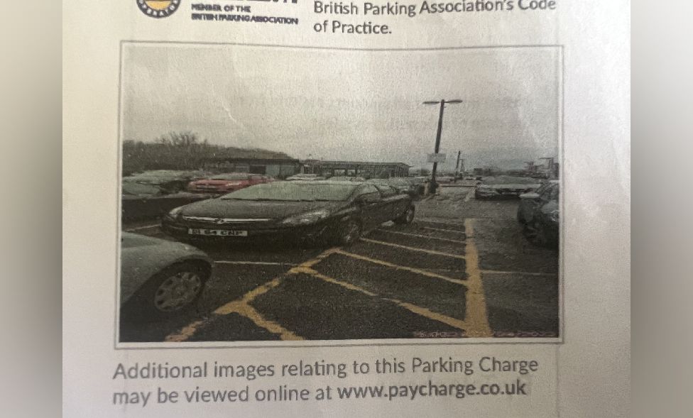 Parking: Cardiff driver's £100 fine after tyres touch yellow box - BBC News