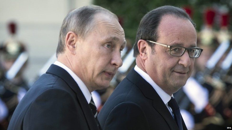 Russian President Vladimir Putin (L) is welcomed by French President Francois Hollande (R) as he arrives at the Elysee Palace for a summit on Ukraine, in Paris, France, 02 October 2015