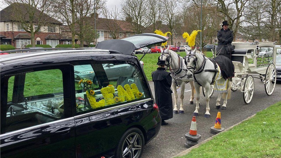 The hearse outside the church