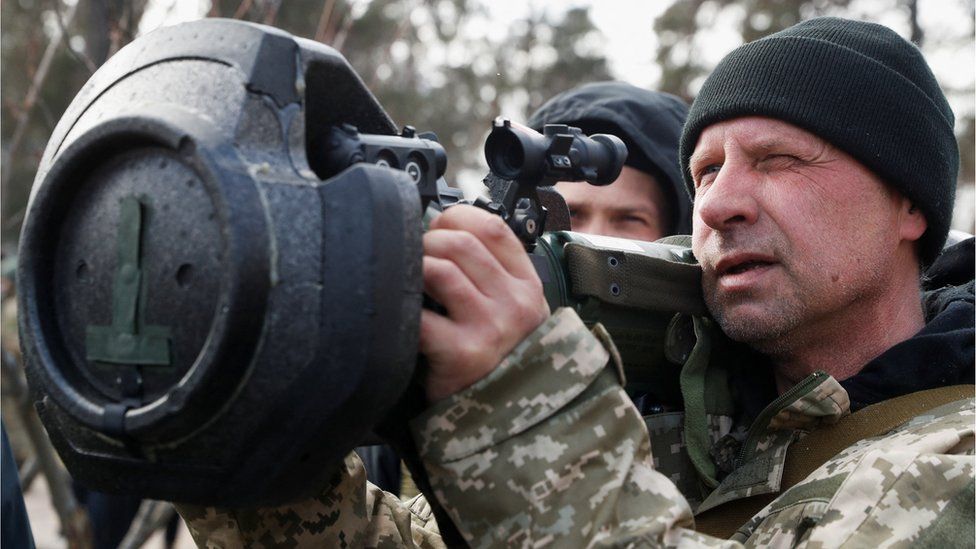 A new member of the Territorial Defence Forces trains to operate an NLAW anti-tank launcher