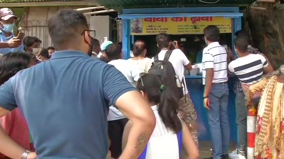Lines of people waiting to buy Mr Prasad's food