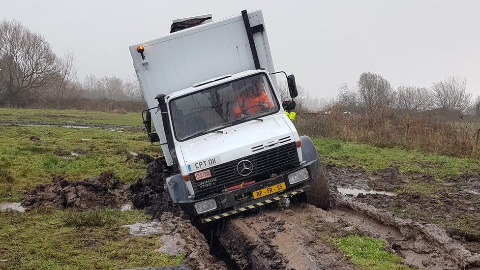 A Unimog vehicle stuck in peaty soil