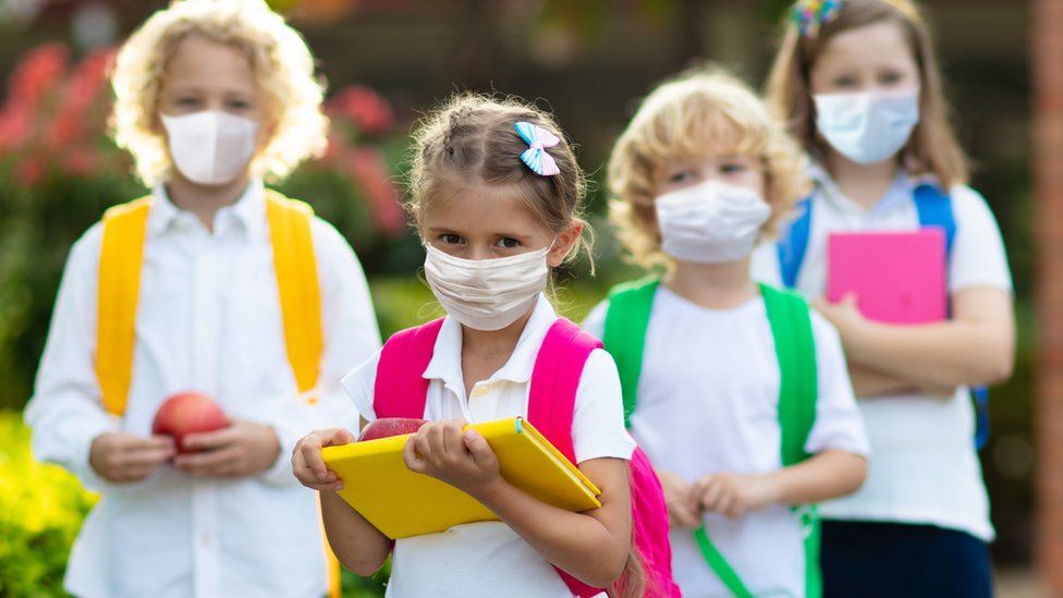 Schoolchildren wearing facemasks