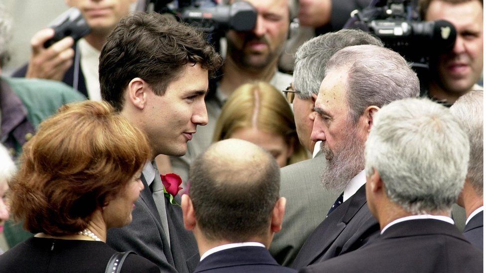 Cuban President Fidel Castro (2ndR) greets Justin Trudeau (2ndL), the son of former Canadian Prime Minister Pierre Trudeau, after arriving at the Notre Dame Basilica for Trudeau's state funeral 03 October 2000.
