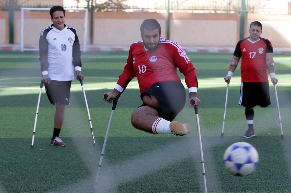 Egyptian Handicapped Mohamed Azeema (C) in action during the first disabled soccer match in Cairo, Egypt, 16 December 2017