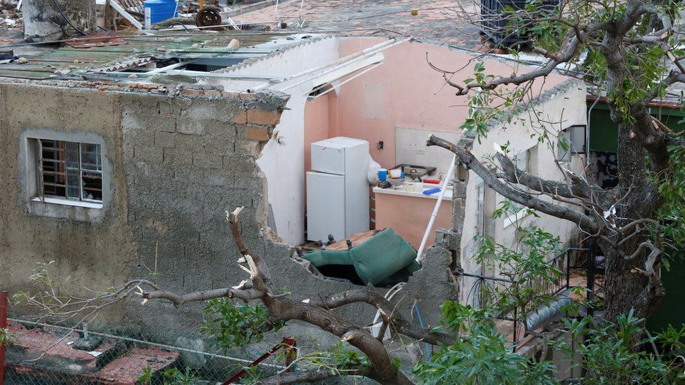A home with a damaged roof in Havana