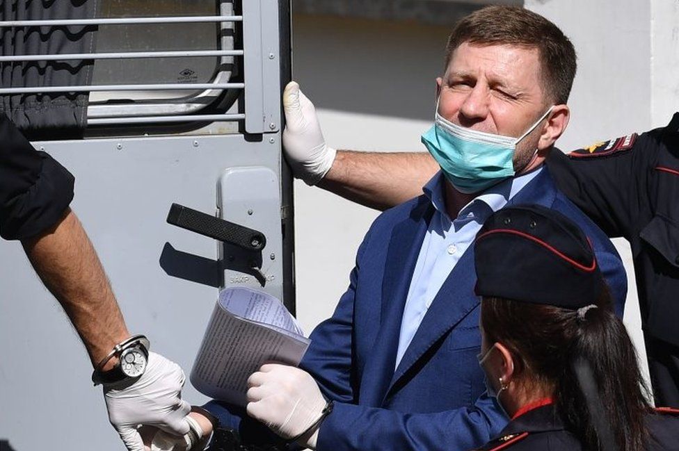 Russia's Khabarovsk region governor Sergei Furgal is escorted into a police van after a court hearing in Moscow on July 10, 2020.
