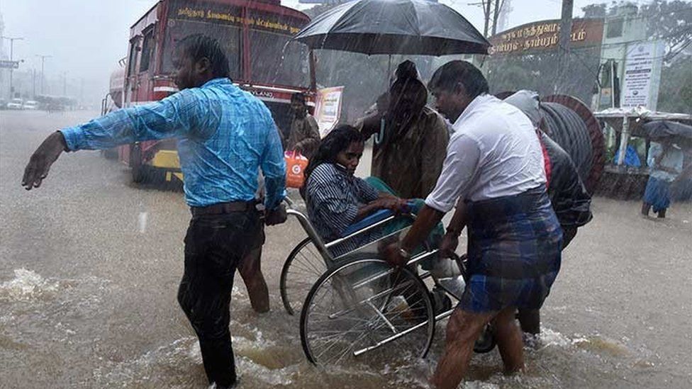 Patients being shifted from a flooded hospital after heavy rains in Chennai.