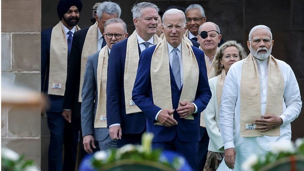 India's Prime Minister Narendra Modi (R), US President Joe Biden (C), German Chancellor Olaf Scholz (3R) and Australia's Prime Minister Anthony Albanese (3L) along with world leaders arrive to pay respect at the Mahatma Gandhi memorial at Raj Ghat on the sidelines of the G20 summit in Delhi on 10 September 2023