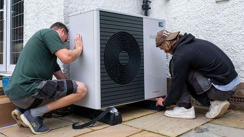 Air source heat pump experts install a heat pump unit into a 1930s built house in Folkestone, UK
