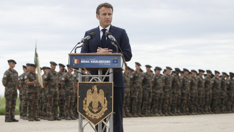 French President Emmanuel Macron delivers a statement as he visits Nato forces at the Mihail Kogalniceanu Air Base, near the city of Constanta, Romania, 15 June 2022