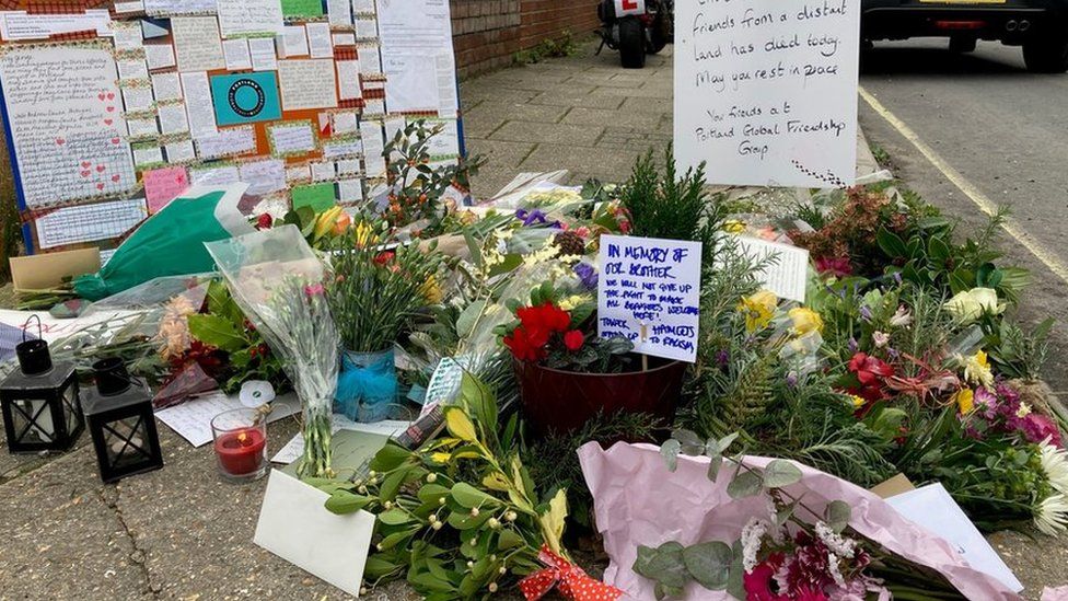 Flowers and messages outside Portland Port