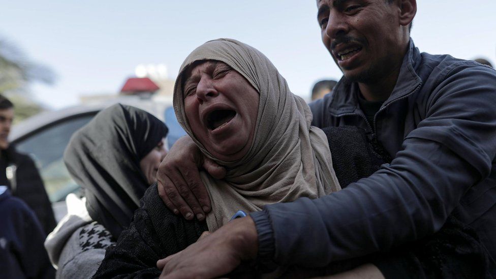 The mother of one of the Palestinians from the Barbakh family, who died during Israeli air strikes in the southern Gaza Strip, mourns outside Nasser Hospital in Khan Younis