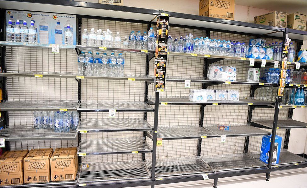 Supermarket shelves are nearly empty in Townsville as people prepare for the cyclone
