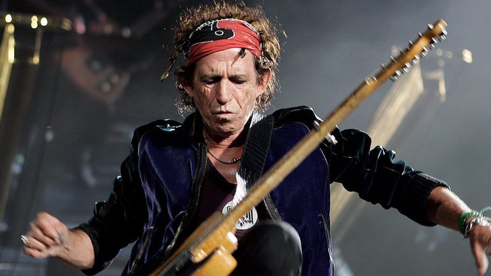 Keith Richards plays on stage with the Rolling Stones