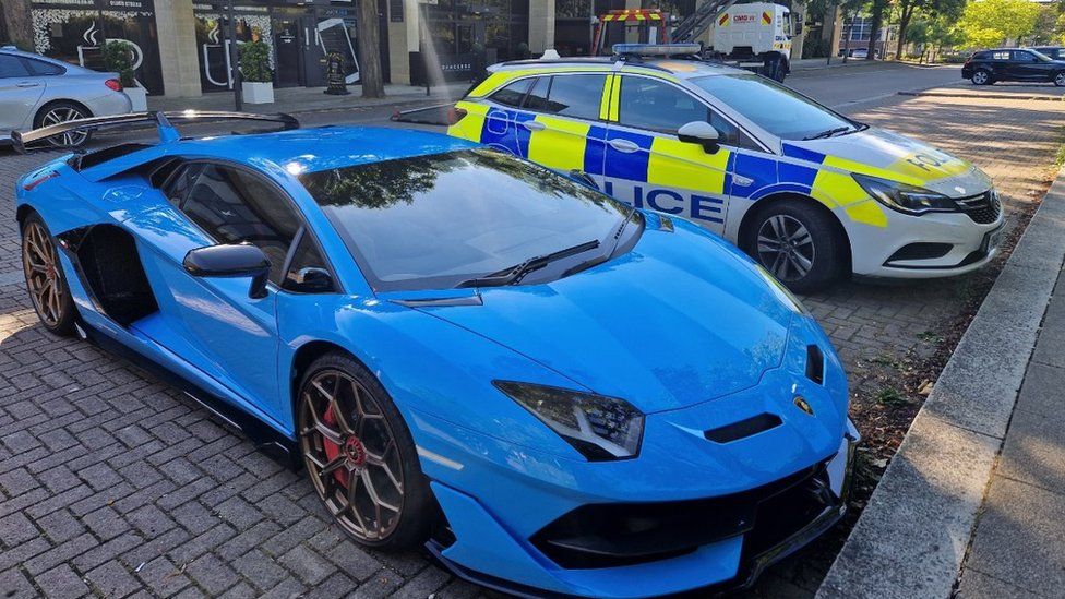 Lamborghini and police car