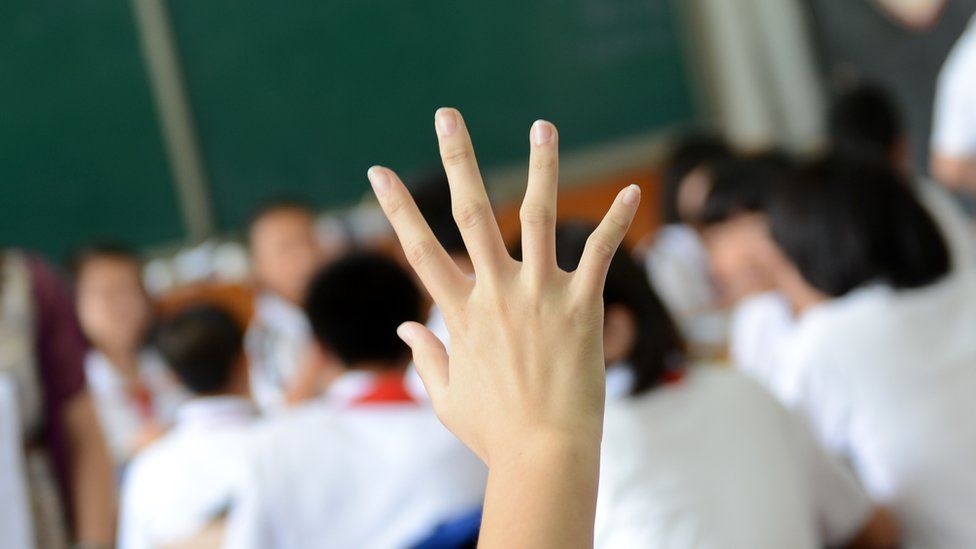 hand raised in classroom