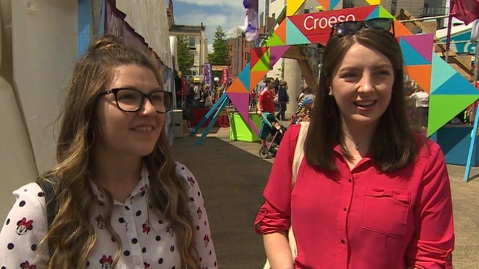 Two women discussing the Urdd Eisteddfod