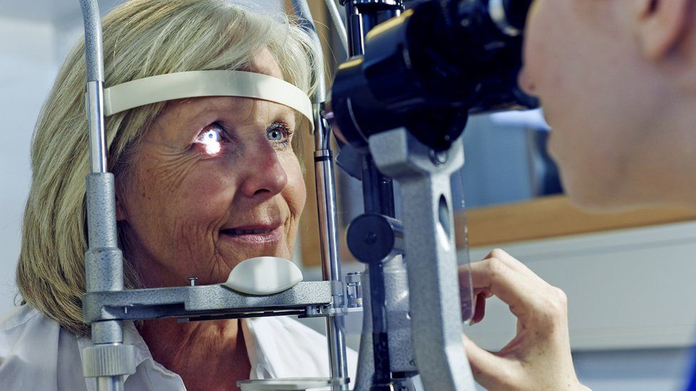 older woman having eye test