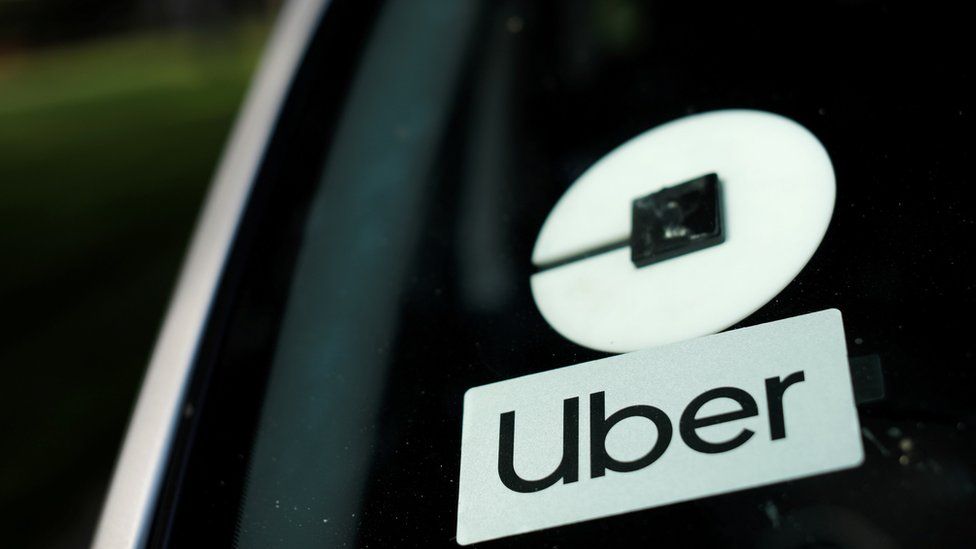 Uber logo sticker on a car windshield