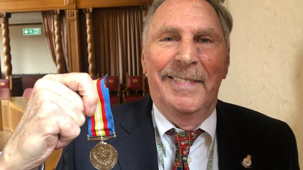 Alan Dowson with his medal