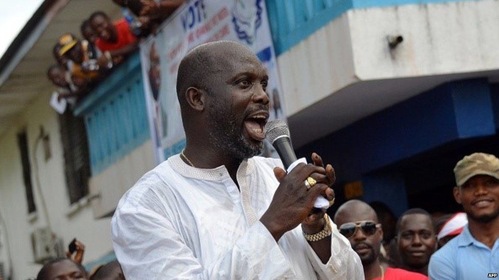 Liberian politician and ex-footballer George Weah speaks during a meeting in Monorovia on November 20, 2014,