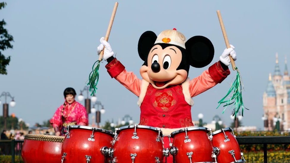 Mickey Mouse plays drums