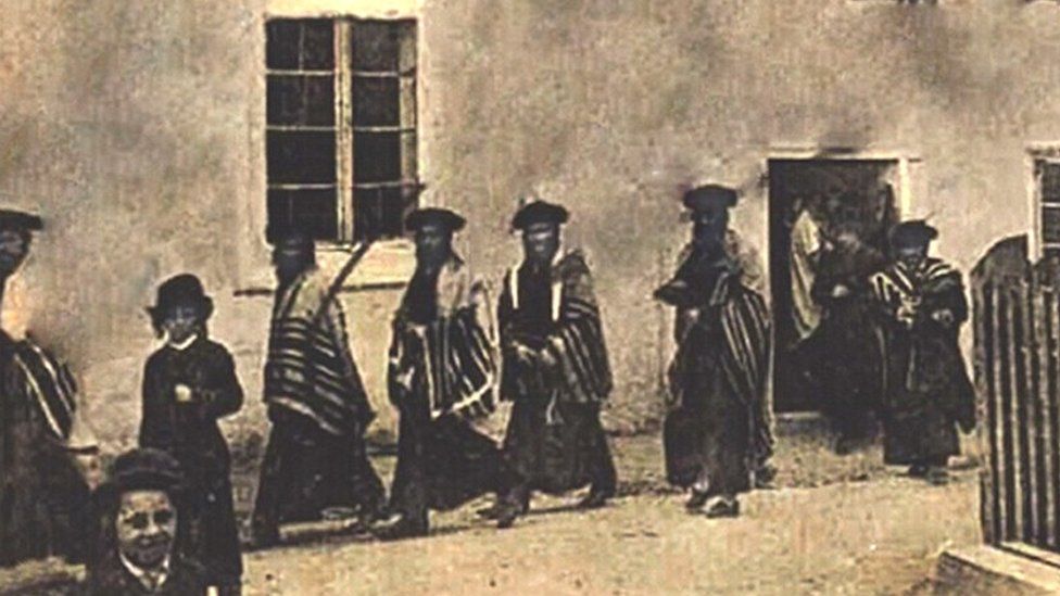 Hassidic Jews in prayer shawls in pre-World War Two Rava-Ruska