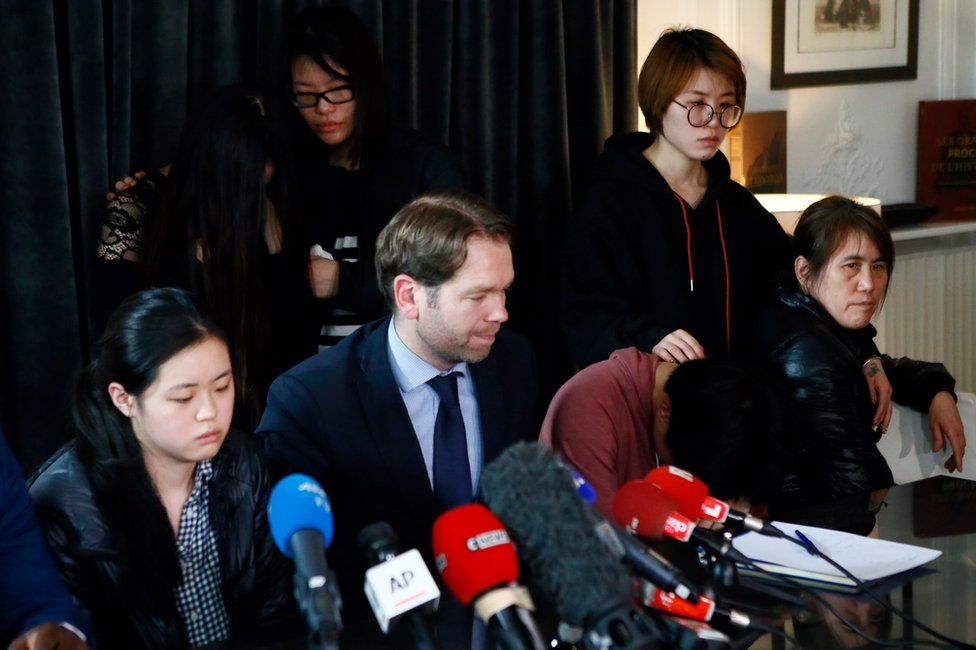 French lawyer Francois Ormillien, center, attends a press conference with the daughter, left, and family members of a Chinese man Shaoyo Liu who was killed Sunday in a deadly police raid in Paris, Wednesday, 29 March 2017.