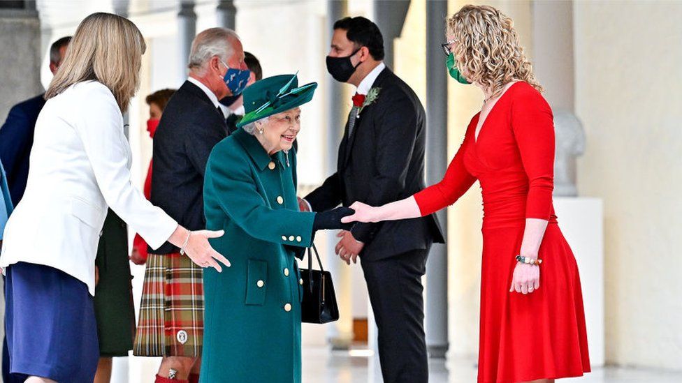 Queen Elizabeth shakes hands with Scottish Green party co-leader Lorna Slater at the opening of the sixth session of the Scottish Parliament attends the opening of the sixth session of the Scottish Parliament on October 02, 2021