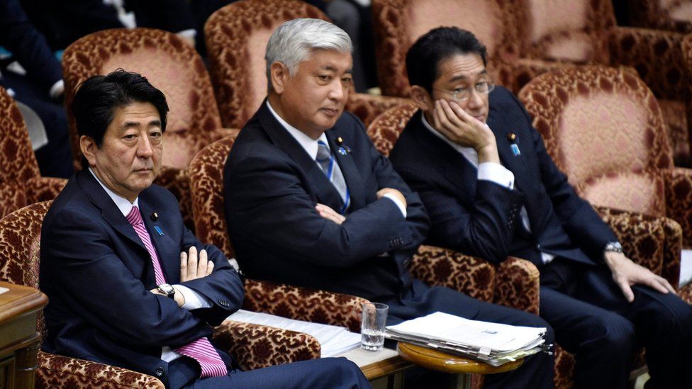 Japanese Prime Minister Shinzo Abe (left), Defence Minister Gen. Nakatani (centre) and Foreign Minister Fumio Kishida wait for the start of Wednesday night's committee