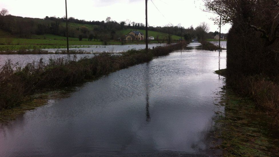 A flooded road in Boho leading to Killyhommon Primary School