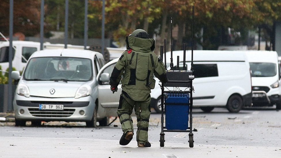 An image of a bomb disposal expert working at the scene of the blast in Ankara