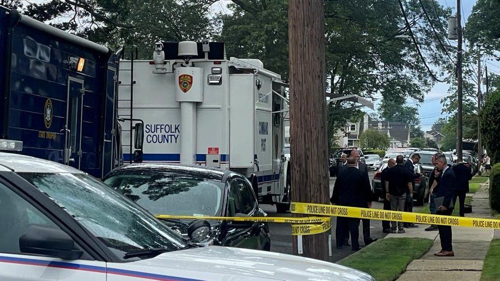 Suffolk County Police and investigators are pictured adjacent   the country   of the apprehension  of a fishy  successful  aggregate  murders of up   to 10 women connected  Long Island successful  Massapequa Park