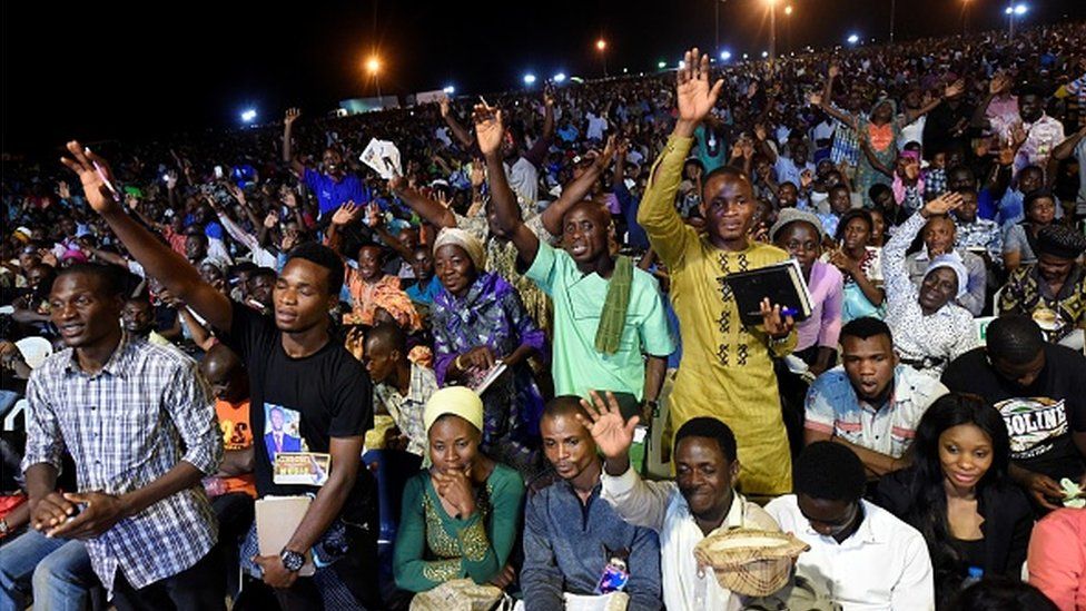 People attend the speech of German pentecostal evangelist Reinhard Bonnke during his "farewell gospel crusade", on November 9, 2017 in Lagos