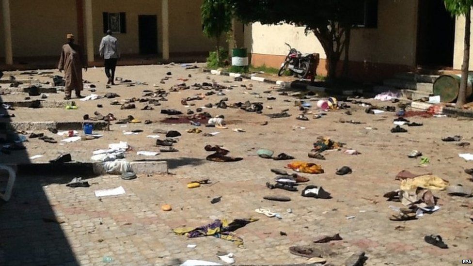 A general view of the scene after a suicide bomber detonated a bomb at a local government building in the Sabon Gari district of the city of Zaria, Kaduna State, northern Nigeria, 7 July 2015