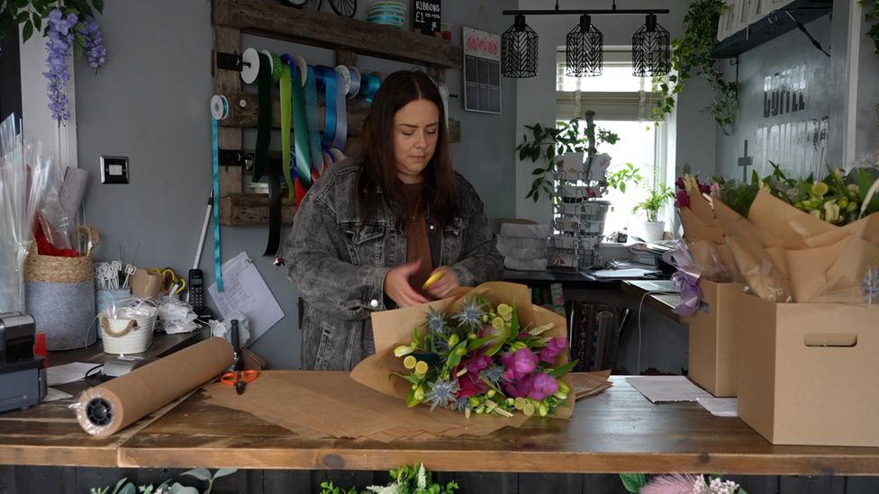 Fredricka Reynolds, florist, at work