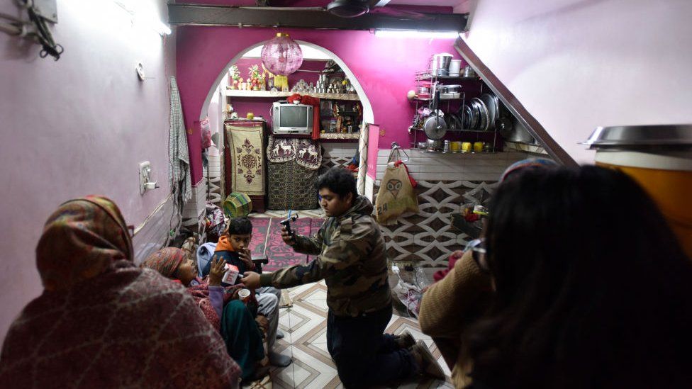 Grieving family members of a 20-year-old girl who had dragged by the car and killed on the night of 31 December, at their home at Sultanpuri, on January 2, 2023 in New Delhi, India.