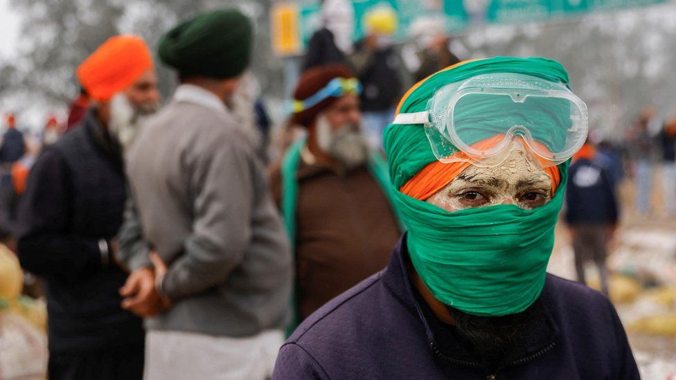 A farmer looks on at the site of the protest, as farmers march towards New Delhi to press for better crop prices promised to them in 2021, at Shambhu barrier, a border crossing between Punjab and Haryana states, India, February 21,