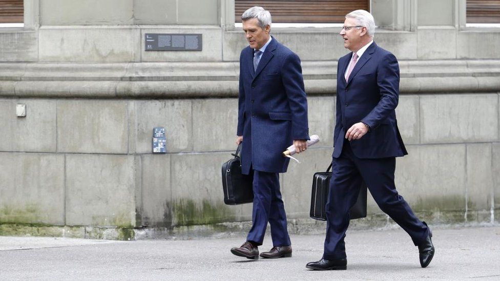 Vice Chairman of the Board of Directors UBS Group AG Lukas Gaehwiler (L) and Member of the Group Executive Board of UBS Group AG Markus Ronner (R) walk in front of the Bernerhof, headquarters of the Swiss Federal Department of Finance FDF, in Bern, Switzerland