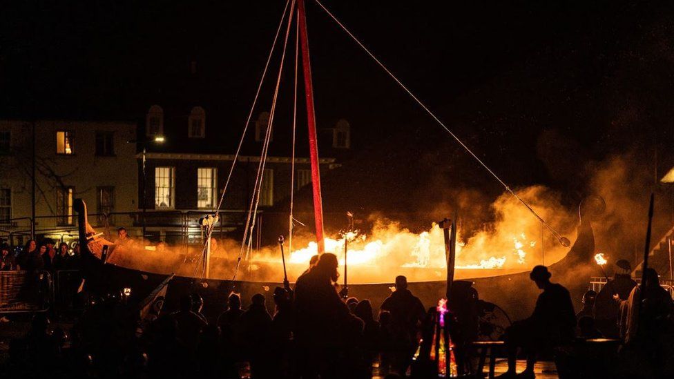 Viking long ship on fire