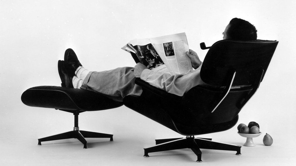 Charles Eames in the lounge chair he and his wife Ray designed