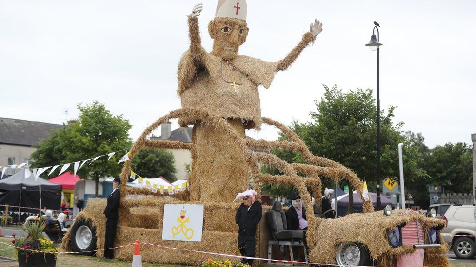 Pope and Popemobile made of hay